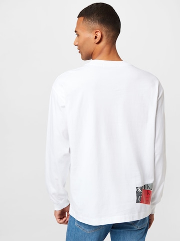 T-Shirt 'DISRUPTED' Calvin Klein Jeans en blanc