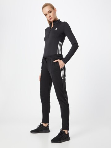 ADIDAS SPORTSWEAR Zwężany krój Spodnie sportowe 'Tricot' w kolorze czarny