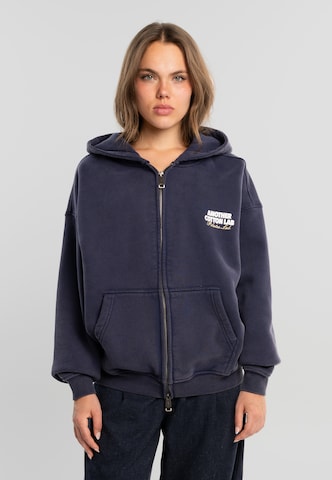 Another Cotton Lab - Sudadera con cremallera 'Community Clubhouse' en azul: frente