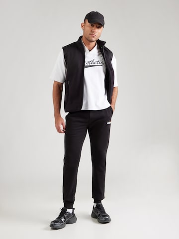 ELLESSE Zúžený strih Nohavice 'Cravo 2' - Čierna