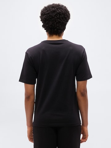 PUMATehnička sportska majica 'ESS' - crna boja