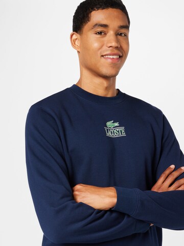 LACOSTE Sweatshirt i blå