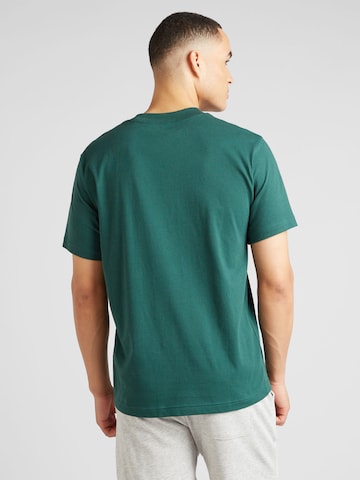 new balance Koszulka w kolorze zielony