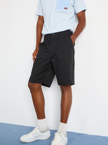 ELLESSE Loose fit Trousers 'Cagola' in Black