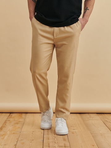 DAN FOX APPAREL Tapered Trousers with creases 'Ediz' in Beige: front