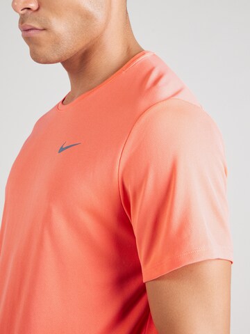 NIKE Функциональная футболка 'MILER' в Оранжевый