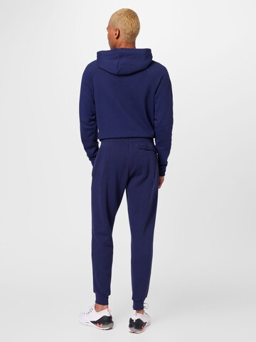 UNDER ARMOUR Tapered Sports trousers in Blue