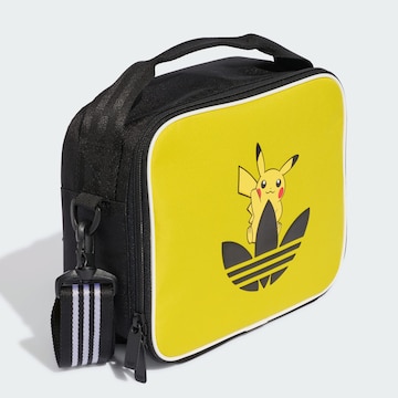 ADIDAS ORIGINALS - Recipiente de almacenamiento 'Pokemon' en amarillo