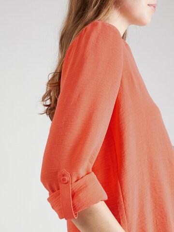 QS - Blusa en naranja