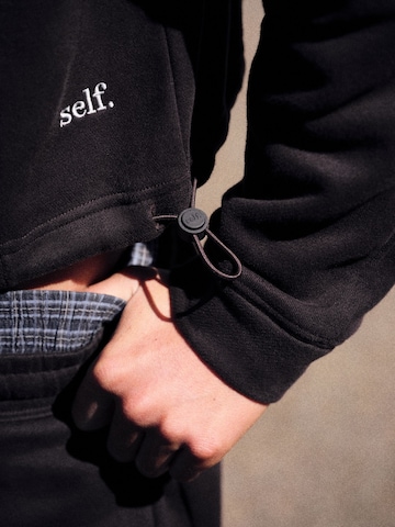 self. - Sudadera en marrón