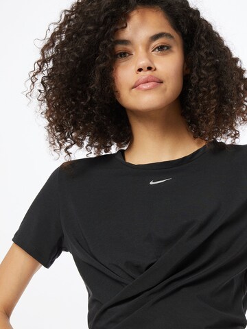 NIKE - Camiseta funcional 'One Luxe' en negro