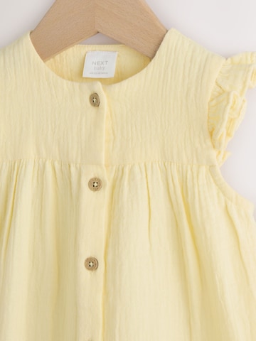 Salopetă de la Next pe galben