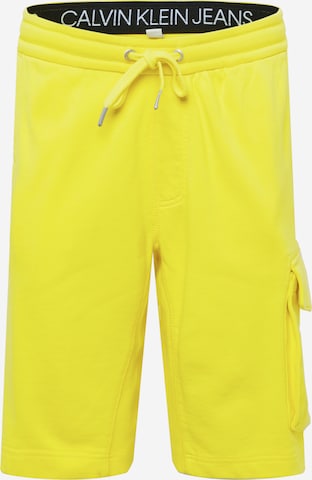 Calvin Klein Jeans Cargo Pants in Yellow: front