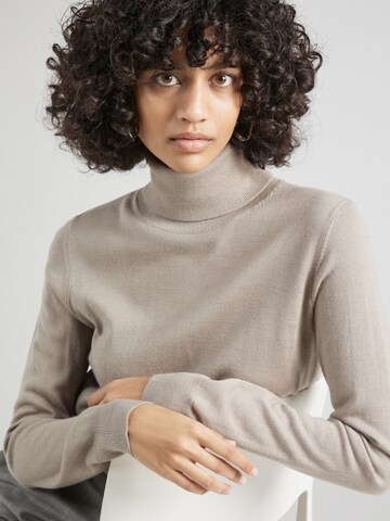 Pull-over Sisley en beige