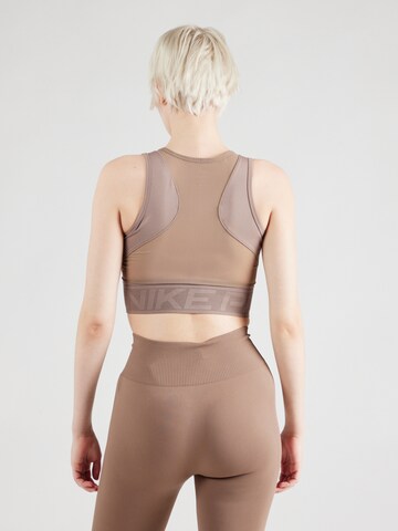 Top sportivo di NIKE in marrone