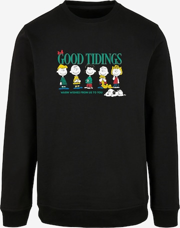 Merchcode Sweatshirt 'Peanuts Good Tidings' in Zwart: voorkant