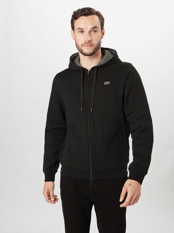 Veste de survêtement LACOSTE en noir : devant