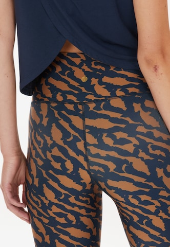 Athlecia Skinny Spodnie sportowe 'Windia' w kolorze brązowy