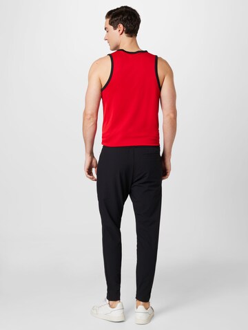 ADIDAS SPORTSWEAR Slimfit Sportsbukser 'City Escape' i svart