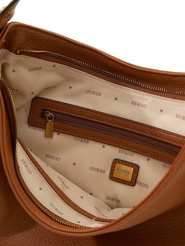 GUESS Schultertasche‌‌‌‌‌ in Braun