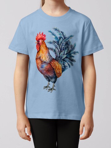 watabout.kids Shirt 'Grimmiger Gockel' in Blauw: voorkant