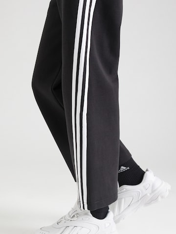 ADIDAS SPORTSWEAR Loose fit Sports trousers 'Future Icons' in Black