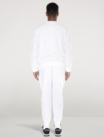 Baggy Pantalon 'UA Unstoppable Fleece Joggers Multicolored' UNDER ARMOUR en blanc
