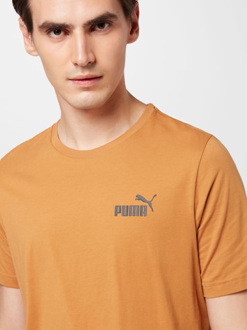 PUMA - Camiseta funcional 'Essentials' en beige