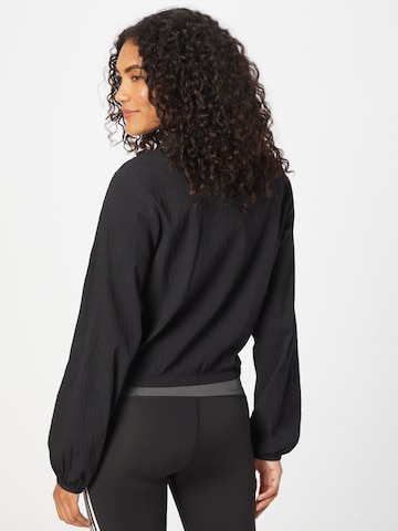 ADIDAS ORIGINALS - Chaqueta de entretiempo en negro