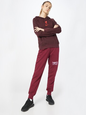 Nike Sportswear Tapered Nadrág - piros