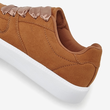 LASCANA Sneakers in Brown