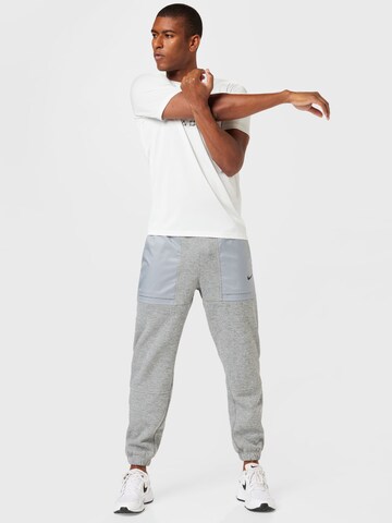 Effilé Pantalon de sport NIKE en gris