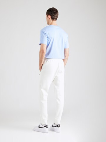 Tapered Pantaloni di Champion Authentic Athletic Apparel in bianco