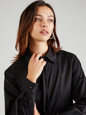 Claire - Blusa 'Rota' en negro