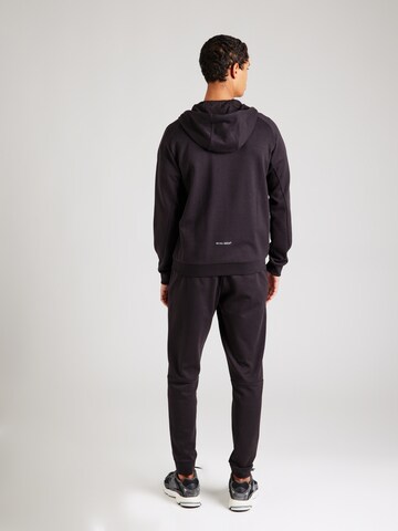 Costum de trening de la EA7 Emporio Armani pe negru