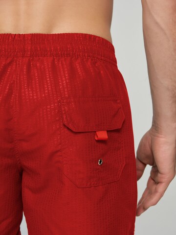 Marc & André Board Shorts in Red