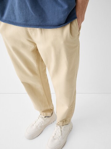 Bershka Tapered Jeans in Beige