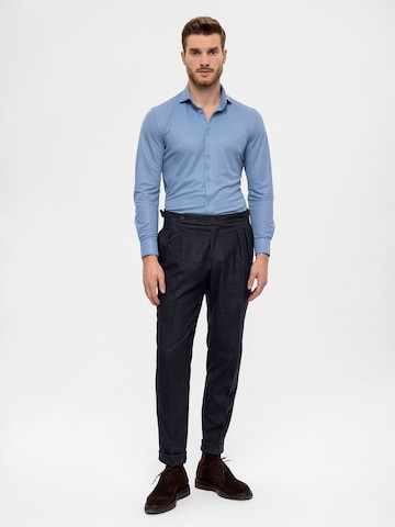 Antioch Tapered Pleat-front trousers in Blue