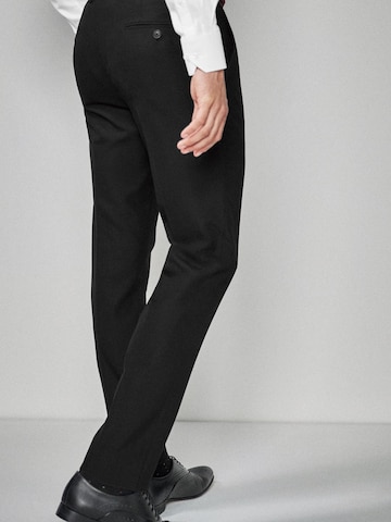 Coupe slim Pantalon à plis Next en noir