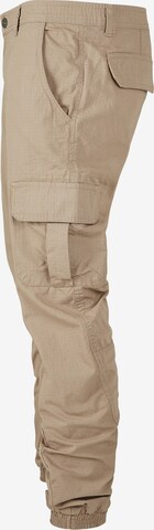 Tapered Pantaloni cargo di Urban Classics in beige