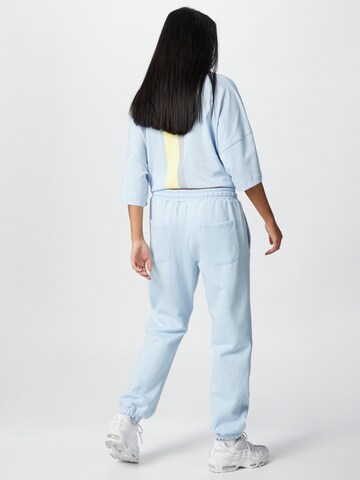 ABOUT YOU x Mero Loose fit Trousers 'Code' in Blue