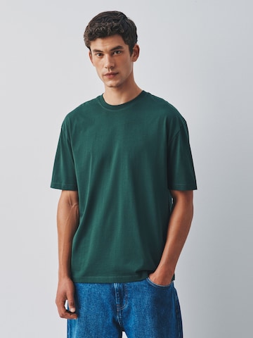 Next T-Shirt in Grün: Vorderseite