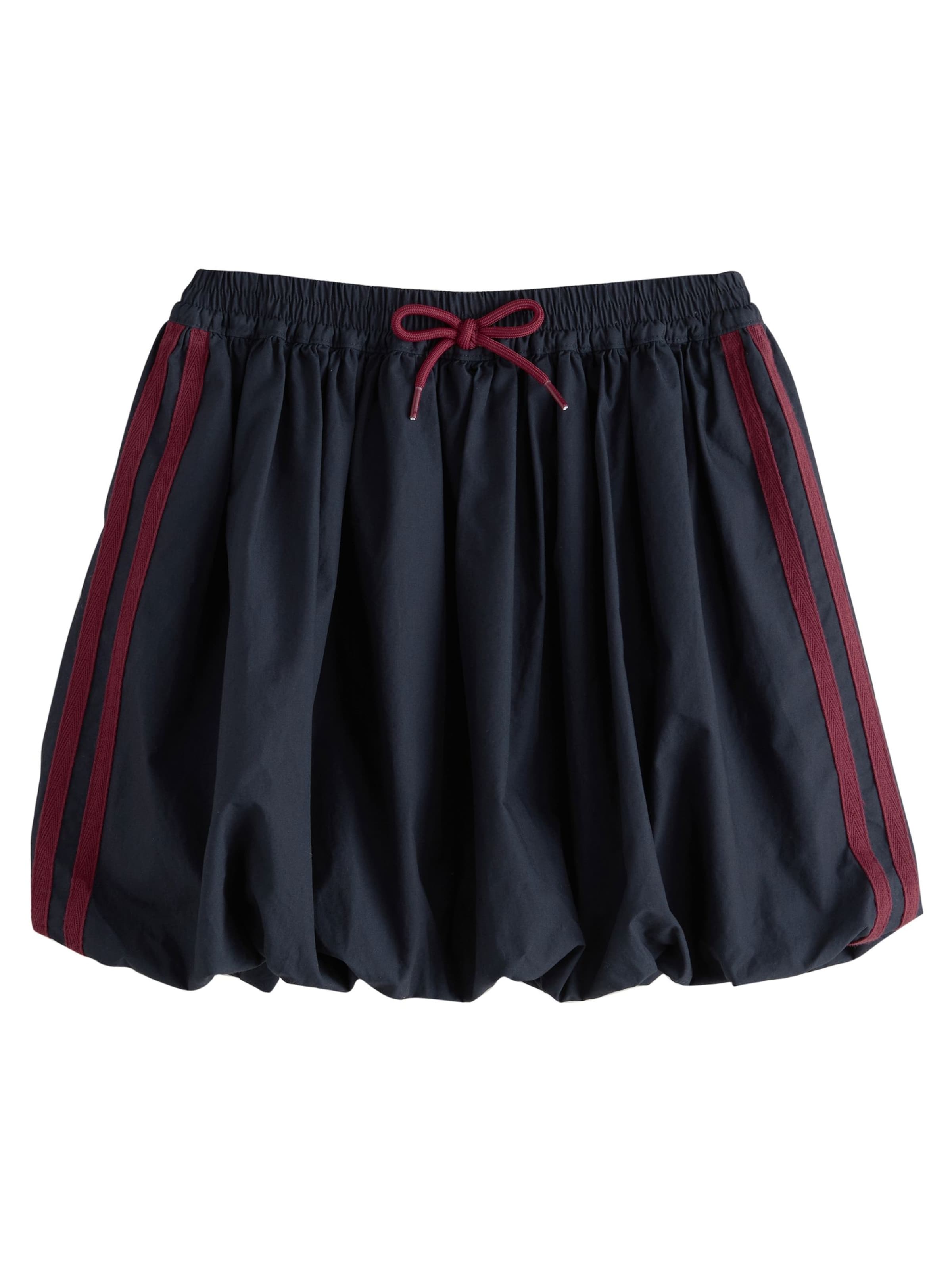 zils Next Svārki: no priekšpuses