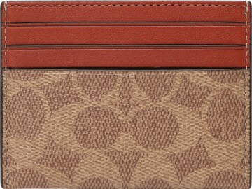 COACH Case in Brown: front