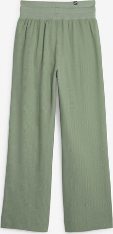 PUMA Szeroka nogawka Spodnie sportowe 'Her' w kolorze zielony