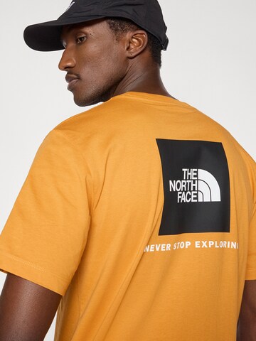 THE NORTH FACE Μπλουζάκι 'EVOLUTION BOX NSE' σε πορτοκαλί