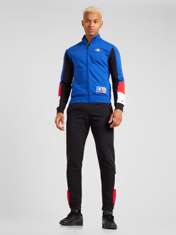 Champion Authentic Athletic Apparel Tracksuit in Blue: front