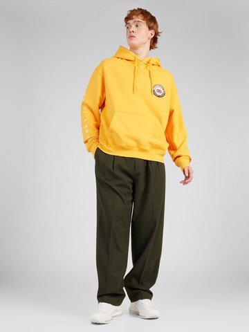 Tommy Jeans - Sudadera 'ARCHIVE GAMES' en amarillo