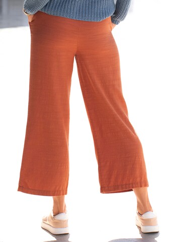 Wide leg Pantaloni con pieghe di LASCANA in arancione