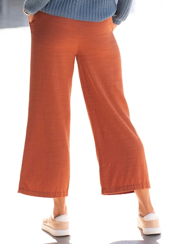 Wide leg Pantaloni con pieghe di LASCANA in arancione